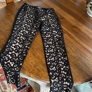 Per Se black pants with lacy embroidery type pattern on front
